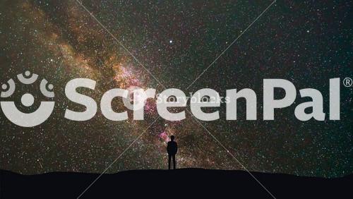 The Man Stand On A Background Of A Milky Way With Asteroids Skyfall. Time Lapse